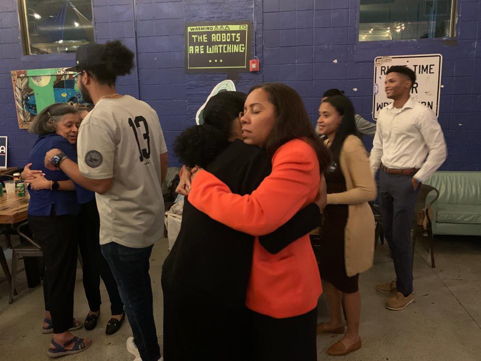 Sabina Matos (right) embraces a woman after declaring victory in the Democratic primary for lieutenant governor on Sept. 13, 2022.