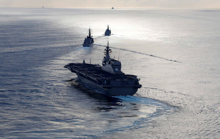 Japanese helicopter carrier Kaga (front) Japanese destroyer Inazuma (C) and British frigate HMS Argyle take part in a joint naval drill in the Indian Ocean, September 26, 2018. Picture taken September 26, 2018. REUTERS/Kim Kyung-Hoon