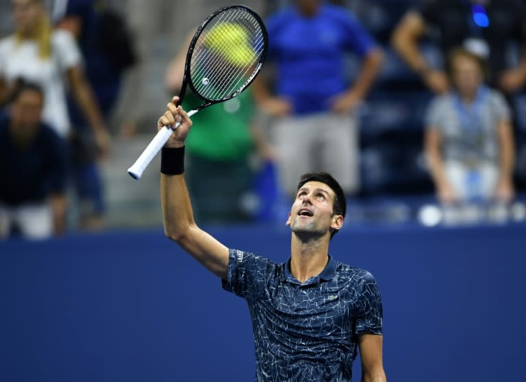 Survive and thrive: Novak Djokovic celebrates victory over John Millman in the US Open quarter-finals
