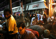 <p>Police officers, ordering the last remaining protesters on the street to get on the ground, spray a chemical agent at those not complying, after the not guilty verdict in the murder trial of Jason Stockley, a former St. Louis police officer charged with the 2011 shooting of Anthony Lamar Smith, in St. Louis, Mo., Sept. 17, 2017. (Photo: Lawrence Bryant/Reuters) </p>