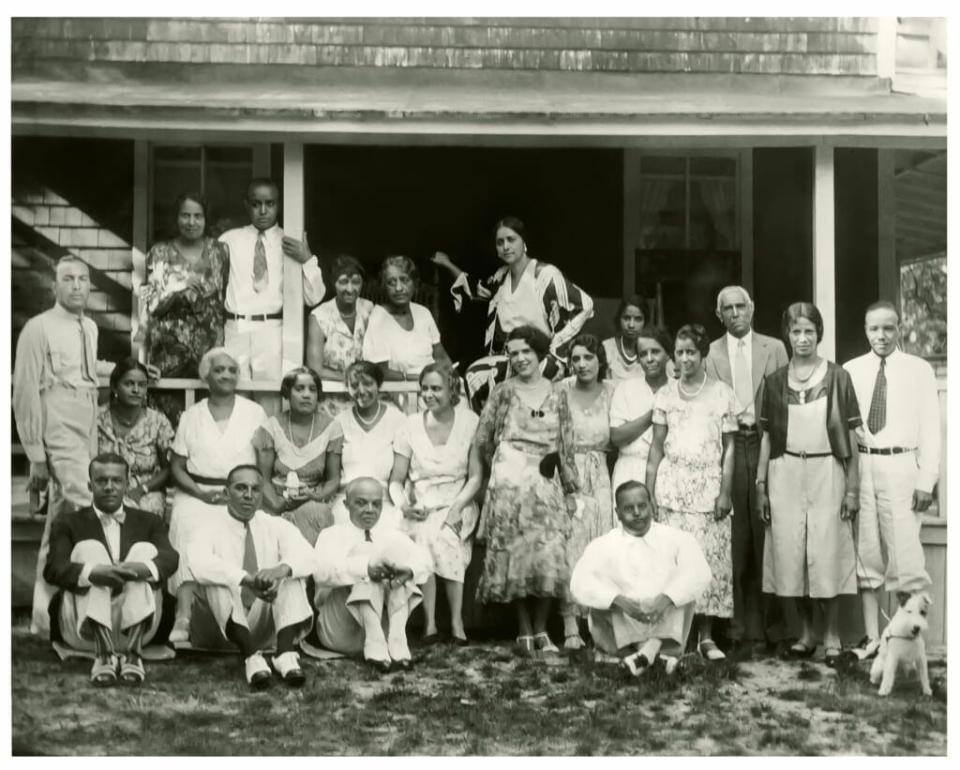 Shearer family and guests, including a young Adam Clayton Powell, Jr. (standing, far left), opera singer Lillian Evanti (top row, fifth from left), and Charles Shearer (standing, third from right) at Shearer Cottage circa 1931. Photo and caption: <a href="https://www.shearercottage.com/history" rel="nofollow noopener" target="_blank" data-ylk="slk:The Inn at Shearer Cottage;elm:context_link;itc:0;sec:content-canvas" class="link ">The Inn at Shearer Cottage</a>/<a href="https://mvmuseum.org/" rel="nofollow noopener" target="_blank" data-ylk="slk:Martha’s Vineyard Museum;elm:context_link;itc:0;sec:content-canvas" class="link ">Martha’s Vineyard Museum</a>
