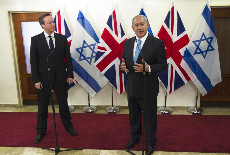 British Prime Minister David Cameron, left, stands next to his Israeli counterpart Benjamin Netanyahu as they deliver joint statements in Jerusalem on Wednesday, March 12, 2014. Cameron made his first visit as British leader to Israel and plans to visit the Palestinian territories this week. (AP Photo/Ronen Zvulun, Pool)