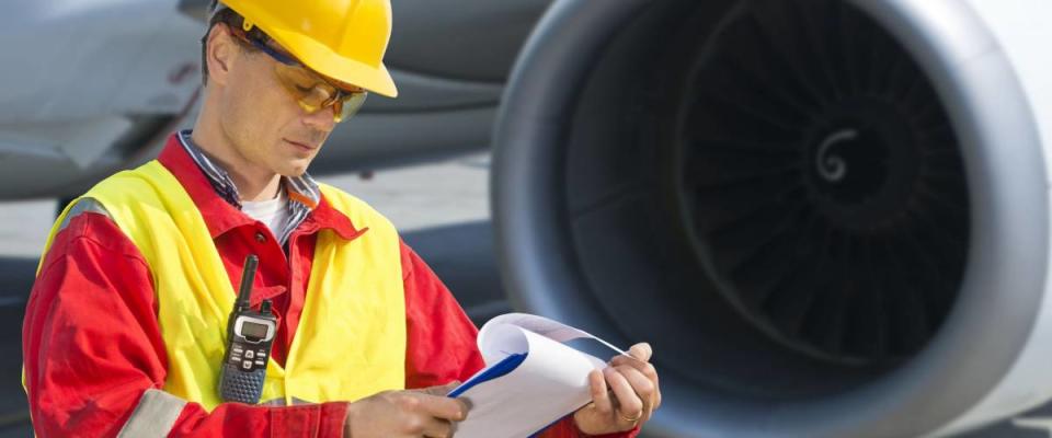 Airline safety engineer going through a pre-flight checklist