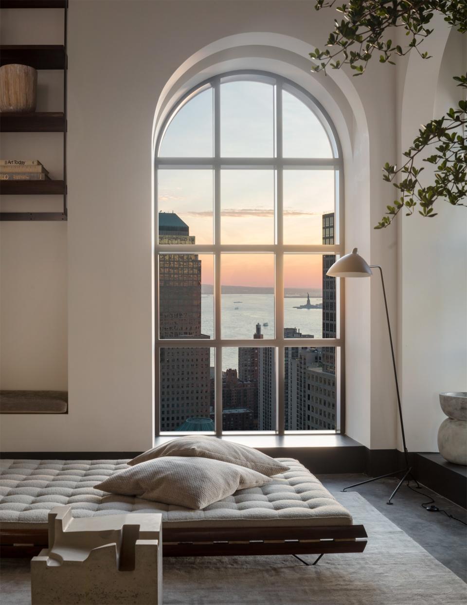 "From the windows you can view the Hudson River, the Statue of Liberty, and the Empire State Building, and, of course, those kinds of views end up being the ultimate focal points of the residence," Ford says. He endeavored to select furnishings and art that complement the sweeping views.