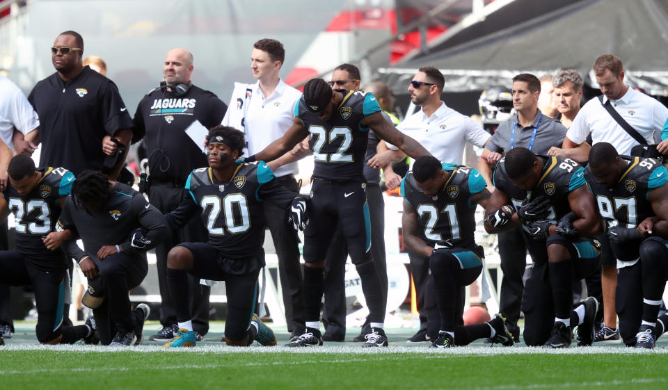 Jacksonville Jaguars players kneel in protest during the national anthem before the NFL International Series match at Wembley Stadium, London on Sept. 24, 2017. (Photo by Simon Cooper/PA Images via Getty Images)