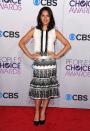 WORST: Olivia Munn. While black and white is always a chic combination on the red carpet, the gorgeous "Newsroom" star looks positively frumpy in this ruffled number.