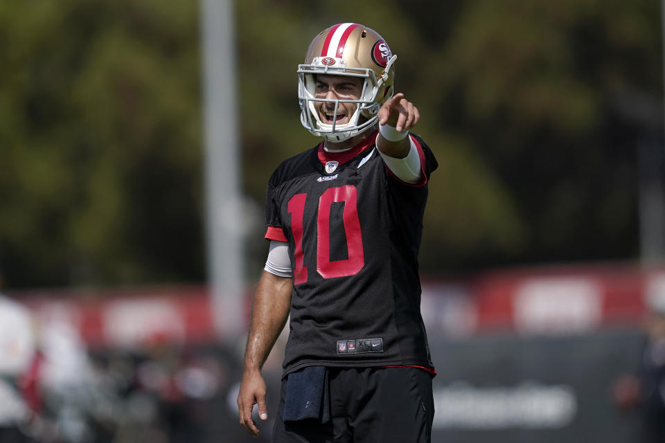 San Francisco 49ers quarterback Jimmy Garoppolo gestures toward teammates at NFL football training camp in Santa Clara, Calif., Wednesday, July 28, 2021. (AP Photo/Jeff Chiu)