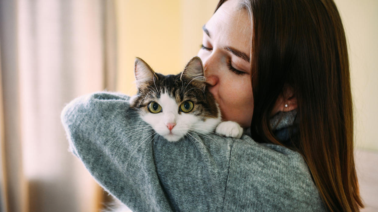  Lady holding cat. 