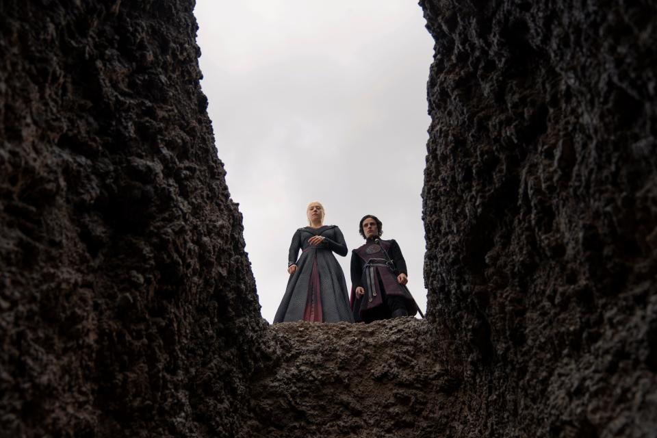 Queen Rhaenyra (Emma D'Arcy) stands with her son Prince Jacaerys (Harry Collett) over the graves of Erryk and Arryk Cargyll in Episode 3 of "House of the Dragon."