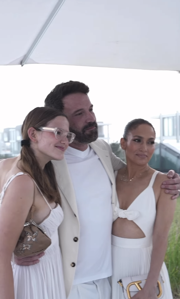ben in the middle with his arms around violet and j.lo