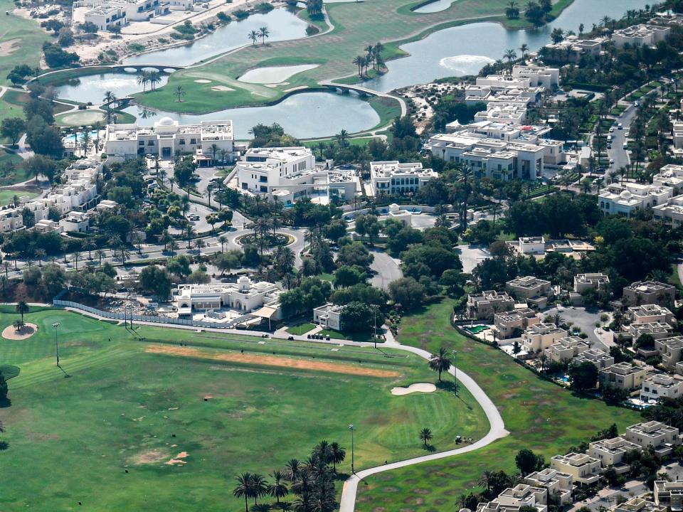 This picture taken on July 8, 2020 shows an aerial view of a Golf course in the Emirates Hills area of the Gulf emirate of Dubai, during a government-organised helicopter tour. - Dubai reopened its doors to international visitors on July 7 in the hope of reviving its tourism industry after a nearly four-month closure.