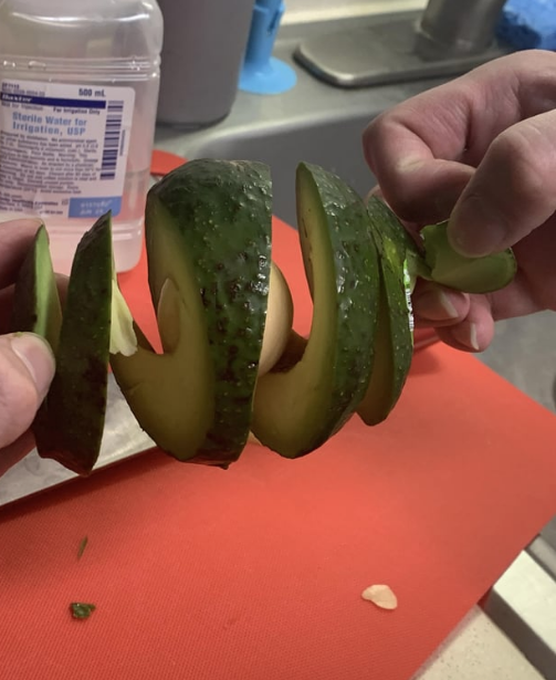 an avocado that's been cut in a spiral