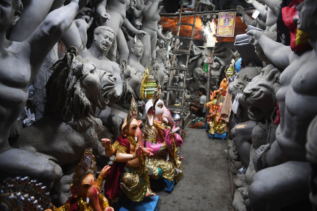 Representative: An artisan works on an idol of Hindu deity inside a workshop in India (AFP via Getty Images)