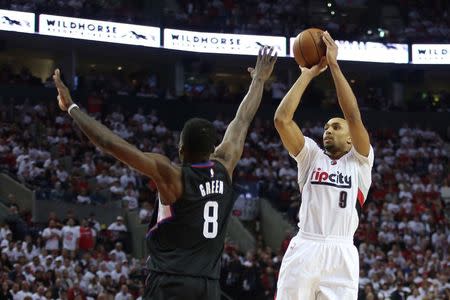 Portland Trail Blazers guard Gerald Henderson (9) shoots over Los Angeles Clippers forward Jeff Green (8) in the second half in game four of the first round of the NBA Playoffs at Moda Center at the Rose Quarter. Mandatory Credit: Jaime Valdez-USA TODAY Sports