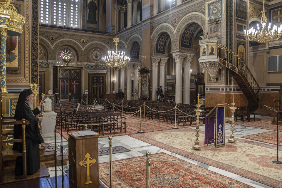 In this Monday, April 13, 2020, photo a priest takes part in a Holy Monday ceremony held without worshippers at Athens Cathedral, in Greece, during a lockdown order by the government to prevent the spread of the coronavirus. For Orthodox Christians, this is normally a time of reflection, communal mourning and joyful release, of centuries-old ceremonies steeped in symbolism and tradition. But this year, Easter - by far the most significant religious holiday for the world's roughly 300 million Orthodox - has essentially been cancelled. (AP Photo/Petros Giannakouris)