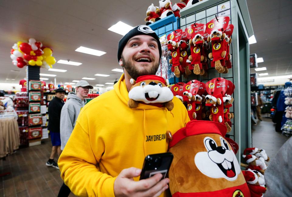 Zack Daugherty makes his way around Missouri's first Buc-ee's with a Buc-ee plush toy stuck in his shirt on Monday, Dec. 11, 2023.