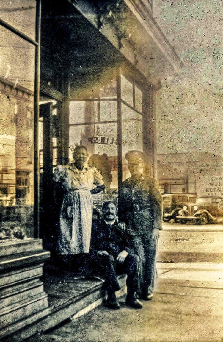 Dominic Conti sits in front of his Paterson store on the corner of Mill and Oliver streets flanked by his wife, Maria, and his son Charles Michael, who served in the U.S. Army during World War II. Conti is often credited for coining the term "submarine sandwich."
