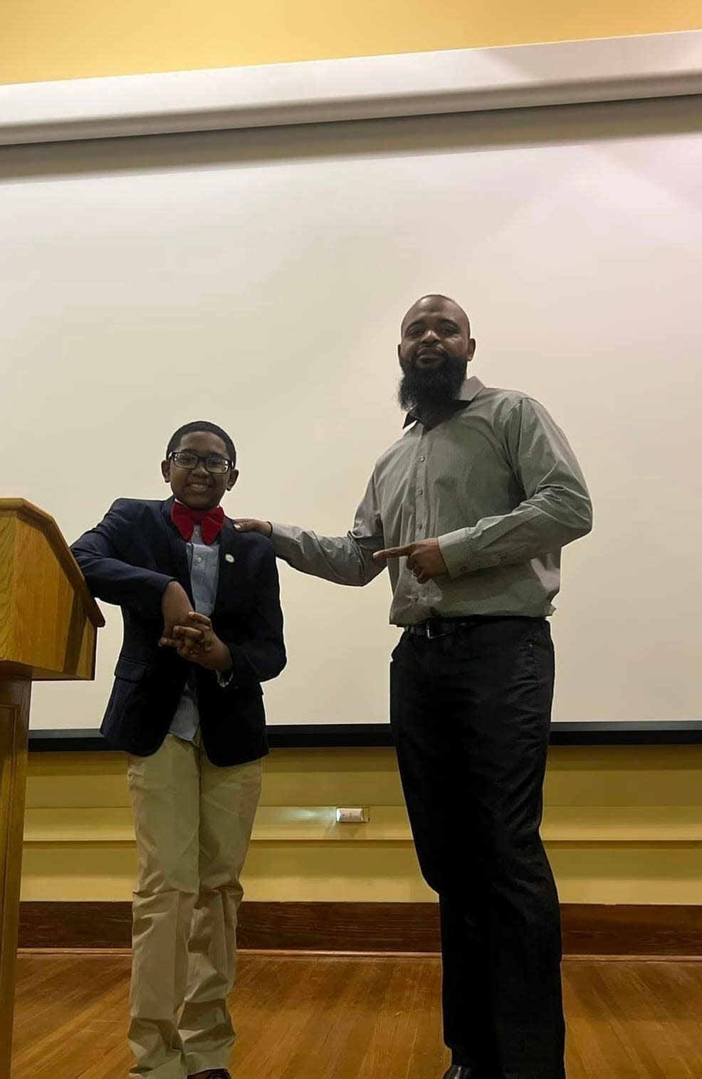 Jerel D. McGeachy Jr., 12, and Chris Ware stand together at Brown v. Board of Education National Historical Park. Jerel spoke in Topeka several times. He was found shot to death April 1 at his home in Kansas City, Missouri,