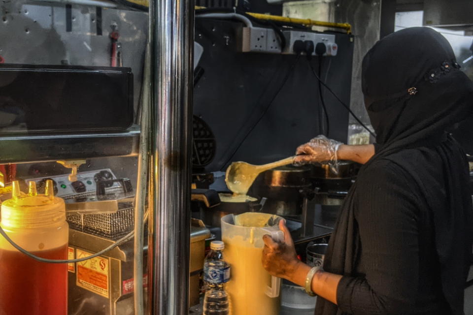 lady making waffles