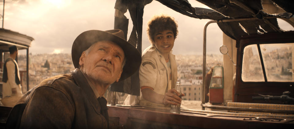 (L-R): Indiana Jones (Harrison Ford) and Teddy (Ethann Isidore) in Lucasfilm's INDIANA JONES AND THE DIAL OF DESTINY. Â©2023 Lucasfilm Ltd. & TM. All Rights Reserved.