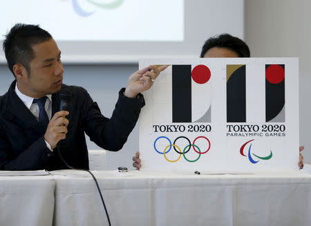 Kenjiro Sano, designer of Tokyo 2020 Olympic and Paralympic Games logos, explains about the designs during a news conference in Tokyo, Japan, August 5, 2015. REUTERS/Yuya Shino