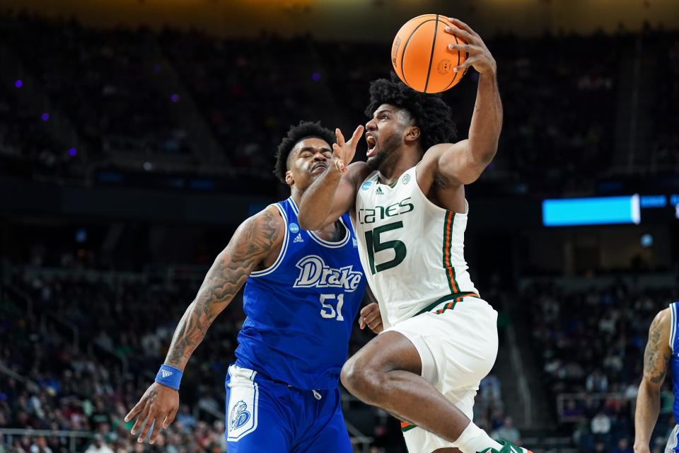 Miami Hurricanes forward Norchad Omier (15) drives to the net against Drake Bulldogs forward Darnell Brodie (51) in the first half at MVP Arena.
