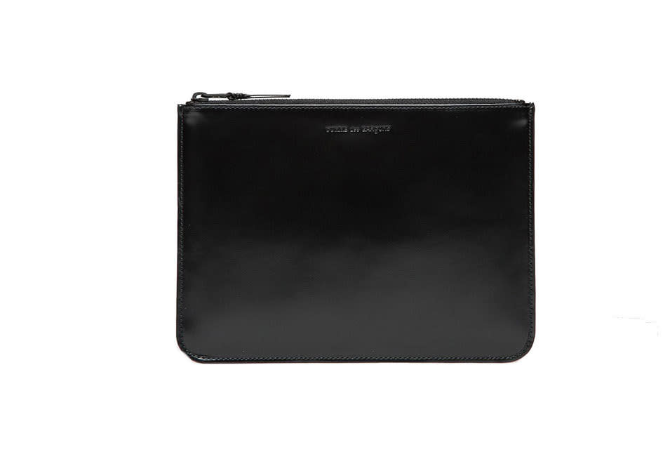 A sleek black pochette that works as a wallet, or — for the true minimalist — as a night-out clutch.
