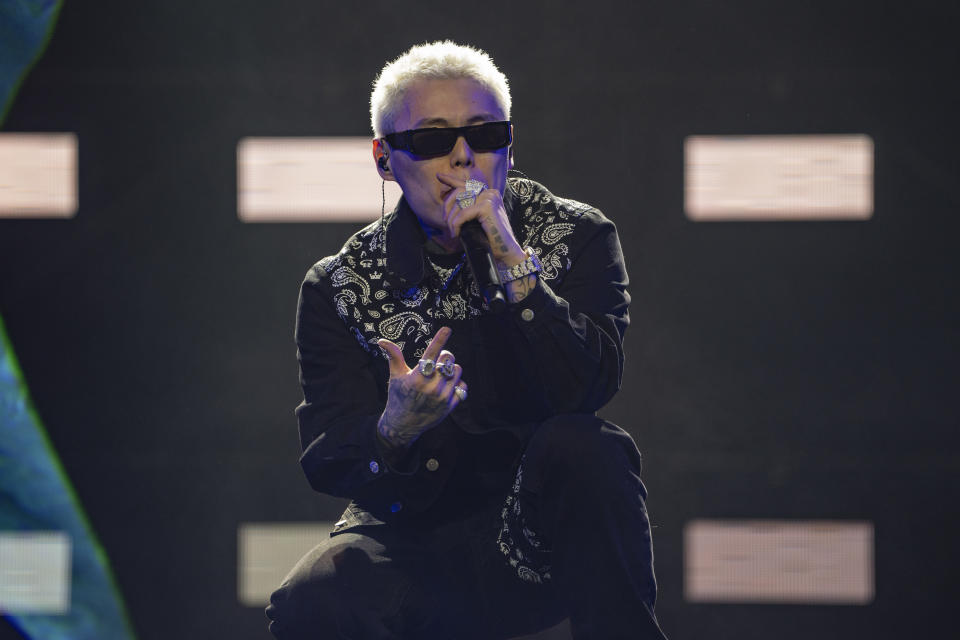 Chinese rapper Boss X performs at a concert in Chengdu in southwestern China's Sichuan province, Saturday, March 16, 2024. The rapper, who had come up from making music in a run-down apartment in an old residential community in the city, was now playing to a stadium of thousands. (AP Photo/Ng Han Guan)