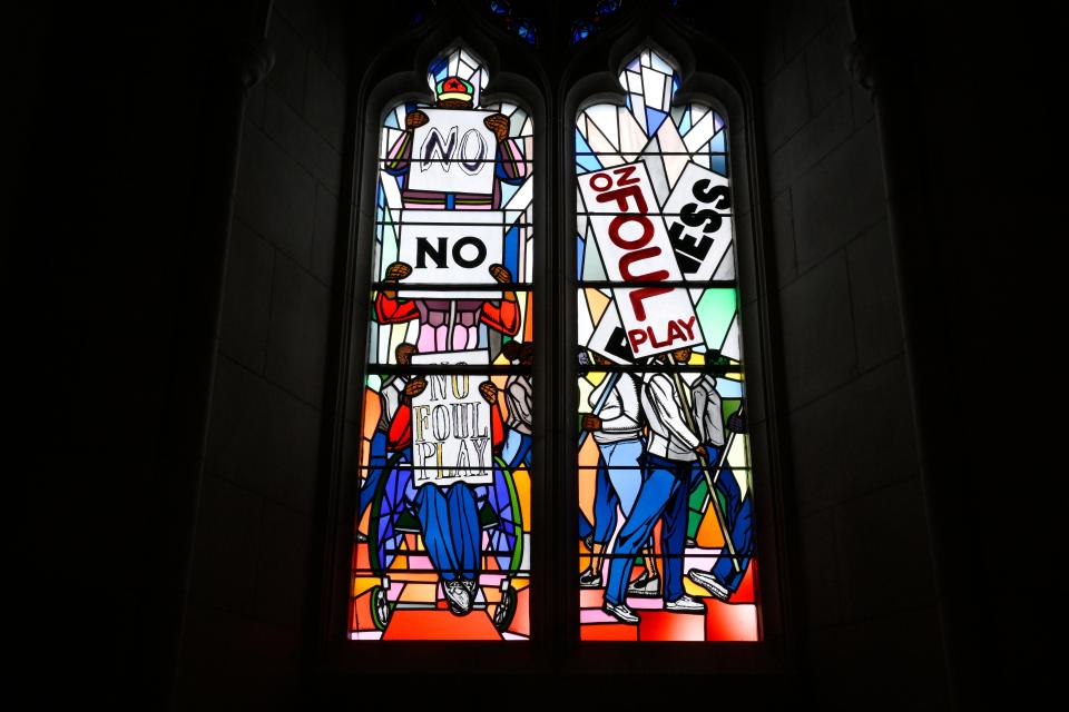 Light shines through new stained-glass windows with a theme of racial justice during an unveiling and dedication ceremony for the windows Saturday at the Washington National Cathedral in Washington, D.C.