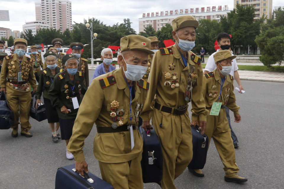 War veterans head to a hotel to attend a national conference of war veterans on the occasion of the 67th anniversary of the end of the Korean War, which the country celebrates as the day of "victory in the fatherland liberation war" in Pyongyang, North Korea Saturday, July 25, 2020. (AP Photo/Jon Chol Jin)