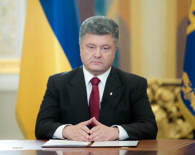 Ukrainian President Petro Poroshenko (centre) during his broadcast address to the nation on June 21, 2014