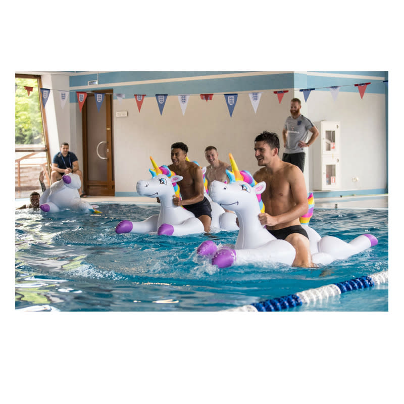 Kieran Trippier, Jordan Pickford, Jesse Lingard and Harry Maguire play with inflatable unicorns in the pool during a recovery session at the ForRestMix Hotel in Repino (REX)