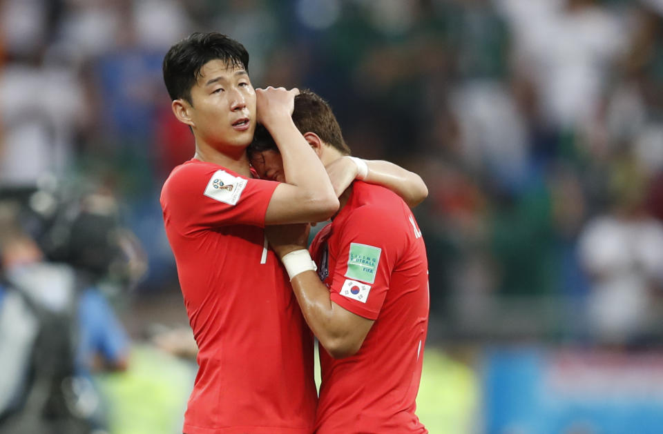 <p>South Korea’s Son Heung-min, left, embraces teammates Hwang Hee-chan at the end of the group F match between Mexico and South Korea. </p>