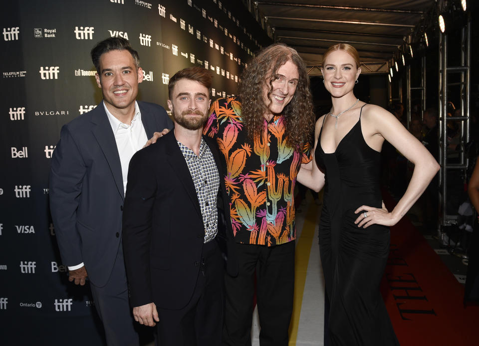 Director Eric Appel, left, Daniel Radcliffe, "Weird Al" Yankovic and Evan Rachel Wood pose together at the premiere for "Weird: The Al Yankovic Story" on day one of the Toronto International Film Festival at the Royal Alexandra Theatre on Thursday, Sept. 8, 2022, in Toronto. (Photo by Evan Agostini/Invision/AP)