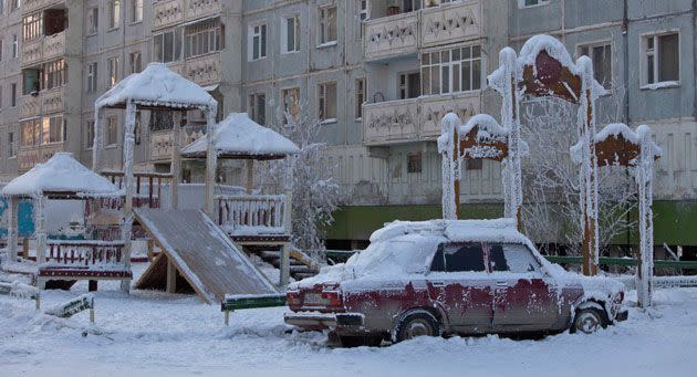 A car covered in ice is pictured near a playground in Yakutsk. Picture: Reuters