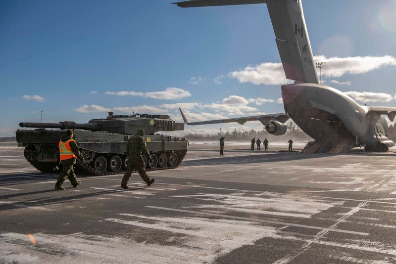 A Leopard 2A4 tank donated to Ukraine is loaded onto a Royal Canadian Armed Forces jet in Halifax