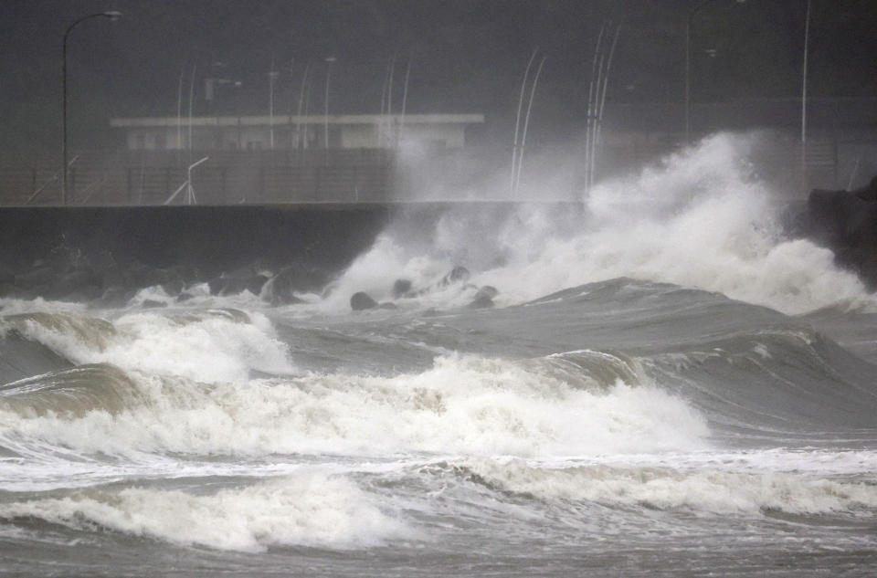 High waves hit the shore in Miyazaki, southern Japan, Sunday, Sept. 18, 2022, as a powerful typhoon approaching southern Japan on Sunday lashed the region with strong winds and heavy rain.(Kyodo News via AP)