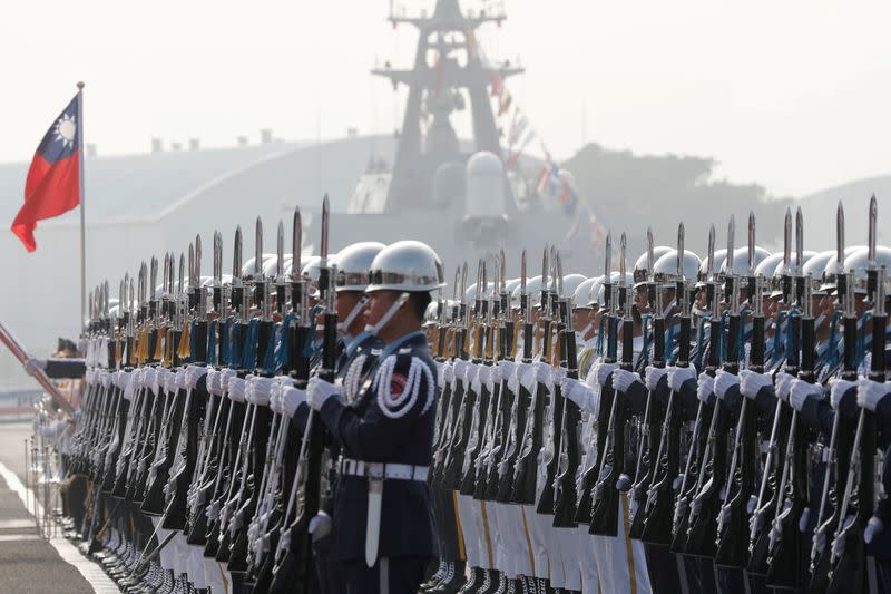 FILE PHOTO: Taiwan's navy sailors take part in a 2018 commissioning ceremony of guided missile frigates, at Kaohsiung's Zuoying naval base