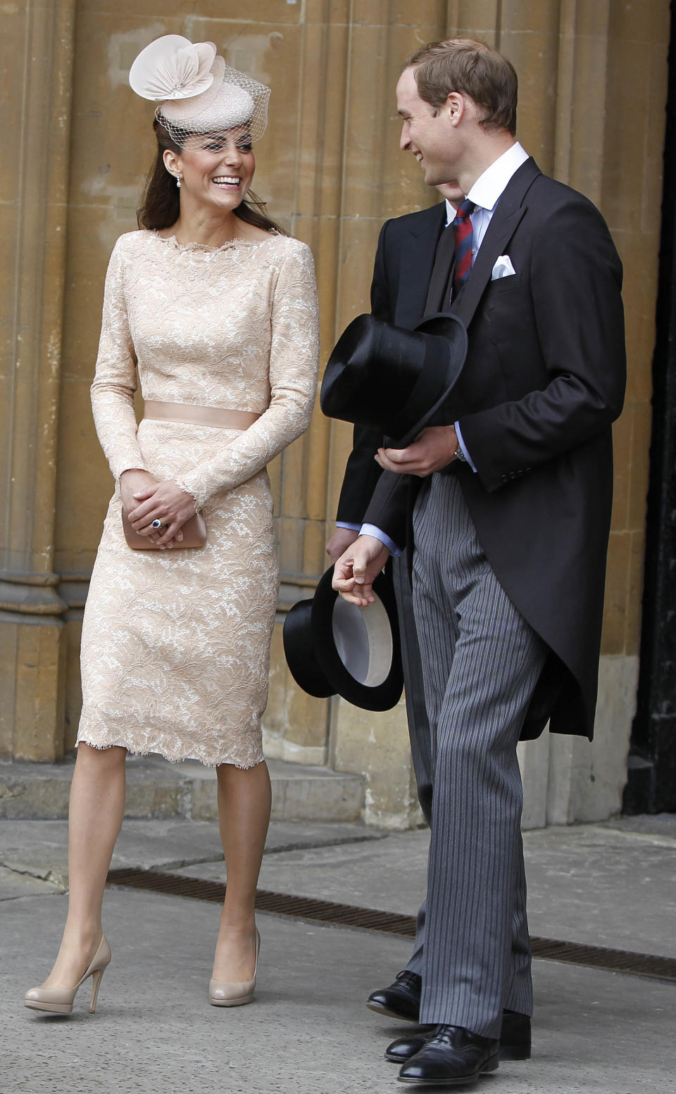 Britain's Prince William and his wife Kate Duchess of Cambridge leave Westminster Hall in London after a Diamond Jubilee Luncheon given for The Queen Tuesday June 5, 2012 . Crowds cheering "God save the queen!" and pealing church bells greeted Queen Elizabeth II on Tuesday as she arrived for a service at St. Paul's Cathedral on the last of four days of celebrations of her 60 years on the throne. (AP Photo/Peter Byrne/Pool)