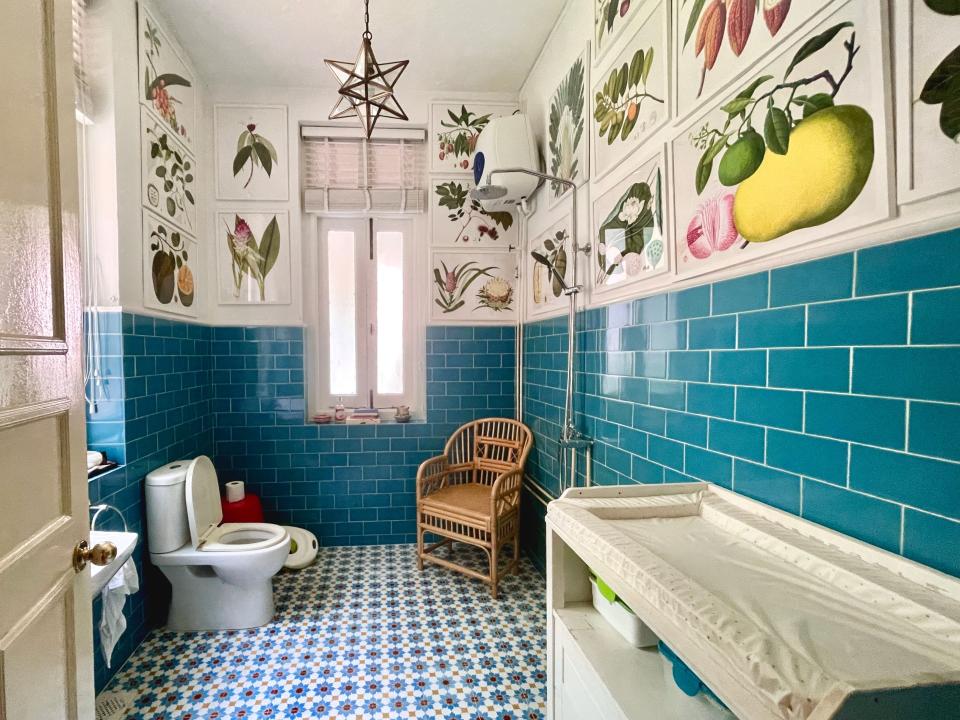 The bathroom on the first floor has framed botanical prints