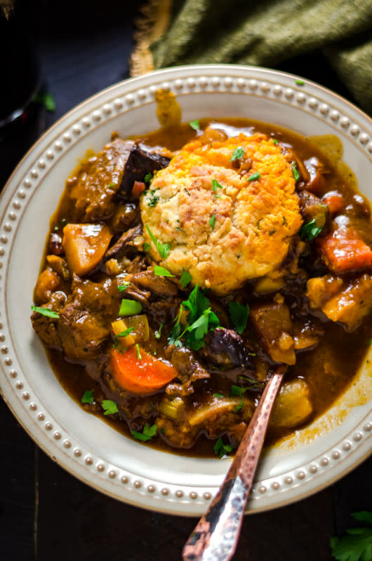 <p>Host the Toast</p><p>A rich, incredibly hearty beef stew with filling cheddar herb dumplings.</p><p><strong>Get the recipe: <a href="https://hostthetoast.com/guinness-beef-stew-with-cheddar-herb-dumplings/" rel="nofollow noopener" target="_blank" data-ylk="slk:Guinness Beef Stew with Cheddar Herb Dumplings;elm:context_link;itc:0;sec:content-canvas" class="link rapid-noclick-resp"><em>Guinness Beef Stew with Cheddar Herb Dumplings</em></a></strong></p>