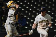 Milwaukee Brewers' Billy McKinney reacts in frot of Pittsburgh Pirates catcher Michael Perez after flying out during the eighth inning of a baseball game Sunday, April 18, 2021, in Milwaukee. (AP Photo/Morry Gash)