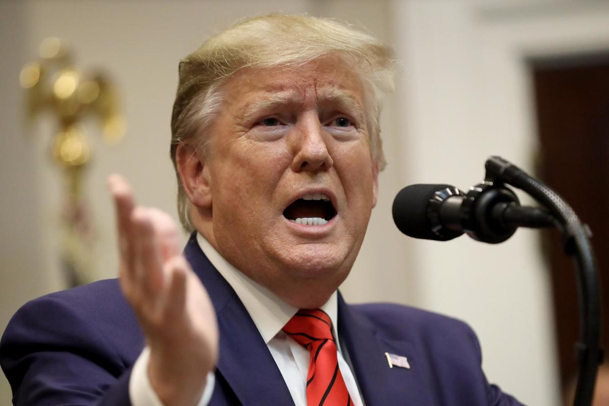 Donald Trump responds to a question from a reporter at an event for the signing of two executive orders at the White House on 9 October, 2019 in Washington, DC: Win McNamee/Getty Images