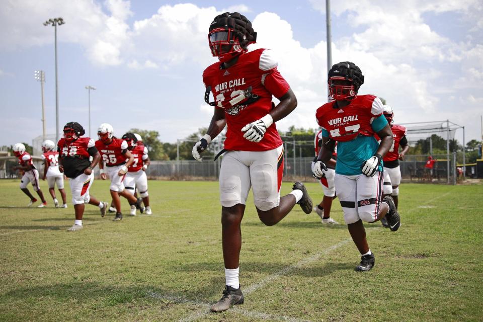 Jackson lineman Deryc Plazz (72) warms up in a football practice during the 2022 season.