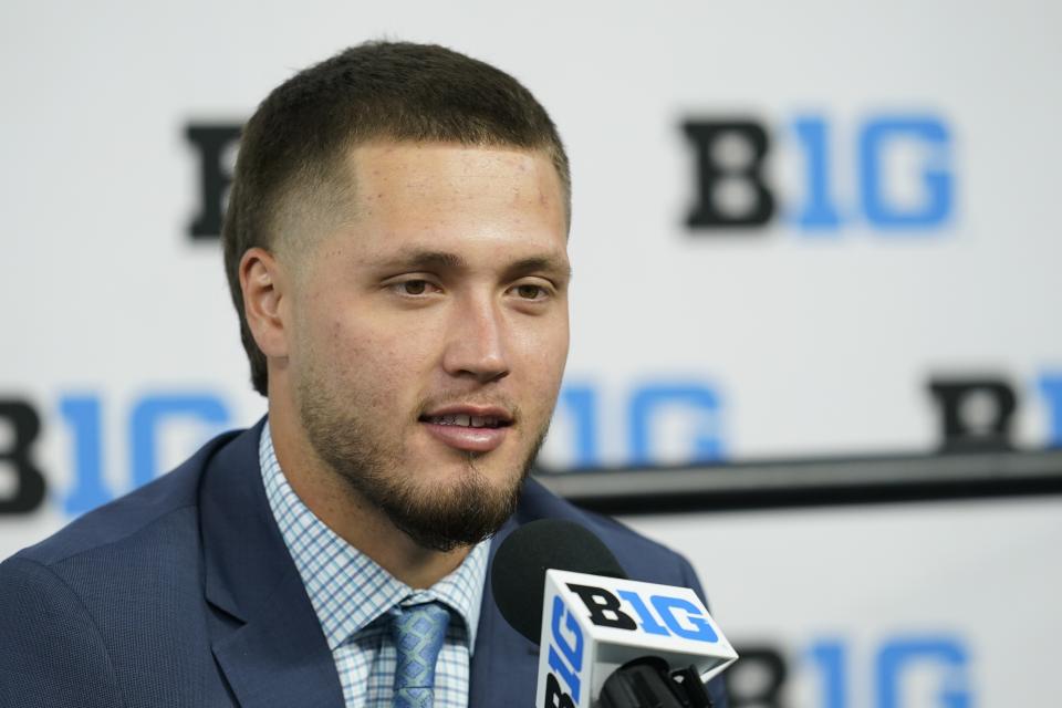 FILE - Wisconsin linebacker Nick Herbig talks to reporters during an NCAA college football news conference at the Big Ten Conference media days, at Lucas Oil Stadium, Wednesday, July 27, 2022, in Indianapolis. Herbig’s teammates noticed something different about him as soon as he arrived on campus two years ago. Herbig is ready to lead a Wisconsin defense that must replace eight of its top 10 tacklers from last season. (AP Photo/Darron Cummings, File)