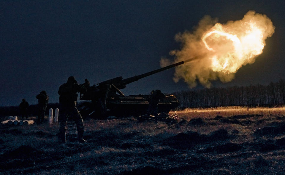 Ukrainian soldiers fire a Pion artillery system at Russian positions near Bakhmut, Donetsk region, Ukraine, Thursday, Dec. 15, 2022. (AP Photo/LIBKOS)