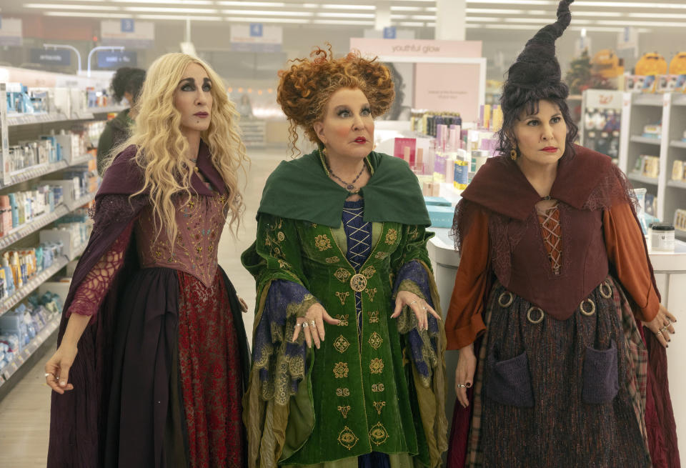 This image released by Disney shows, from left, Sarah Jessica Parker as Sarah Sanderson, Bette Midler as Winifred Sanderson, and Kathy Najimy as Mary Sanderson in "Hocus Pocus 2." (Matt Kennedy/Disney via AP)