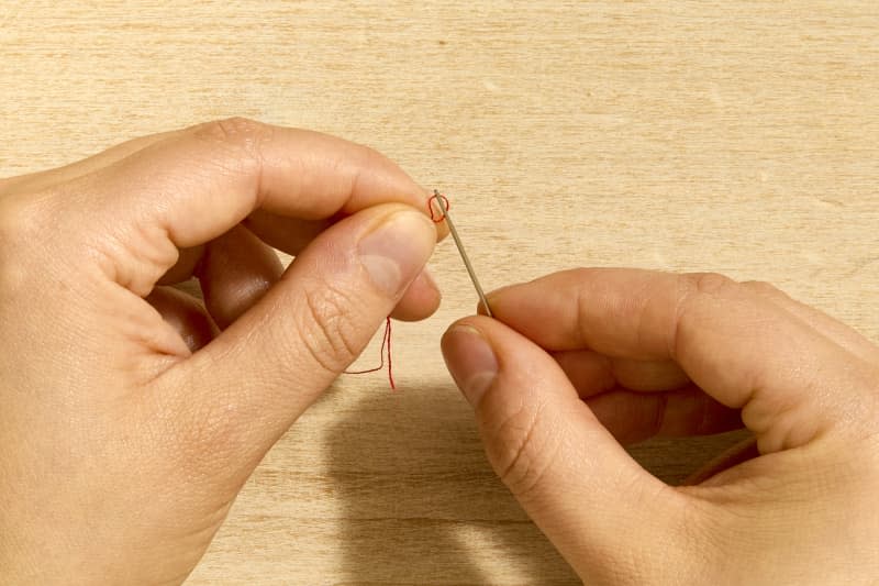 shot of needle being threaded