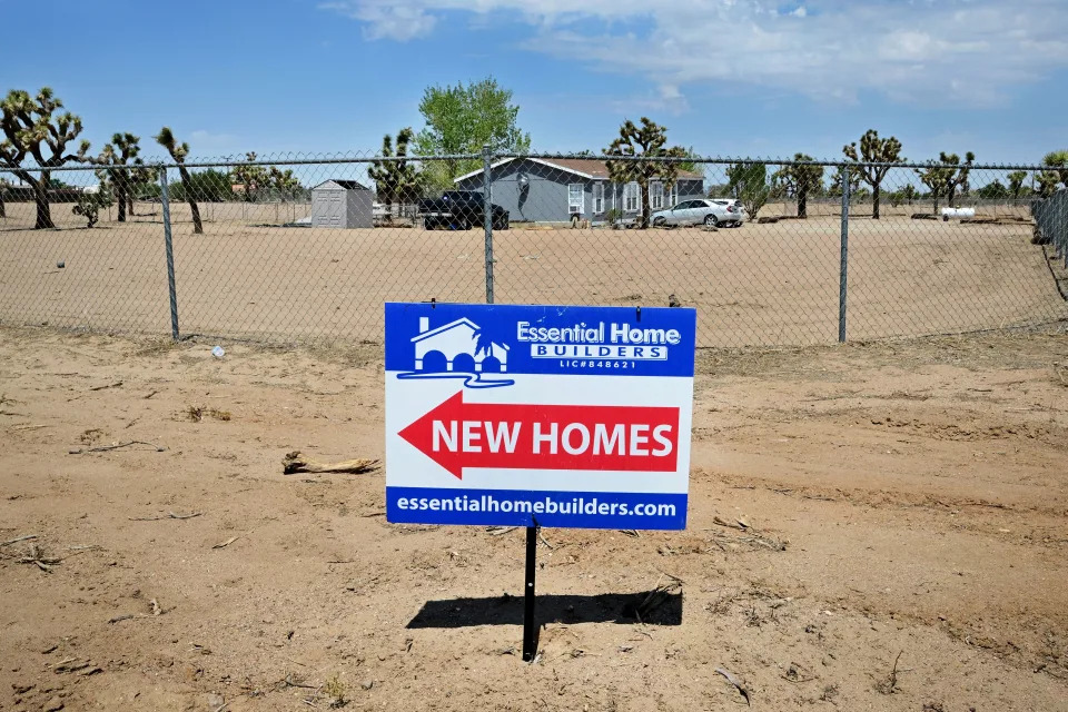 A sign points to new homes in Hesperia, California on August 18, 2022. - US home sales fell nearly 6% in July, 2022 as the housing market slides into a recession, as sales dropped about 20% from the same month a year ago. (Photo by Frederic J. BROWN / AFP) (Photo by FREDERIC J. BROWN/AFP via Getty Images)