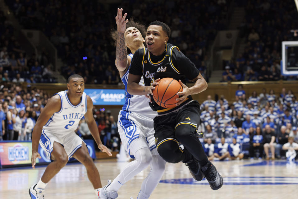 La Salle's Jhamir Brickus, right, drives past Duke's Tyrese Proctor, left, during the first half of an NCAA college basketball game in Durham, N.C., Tuesday, Nov. 21, 2023. (AP Photo/Ben McKeown)